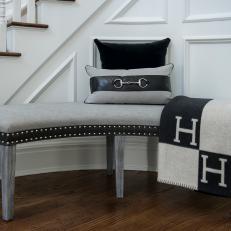 Curved Gray and Black Bench With Pillow