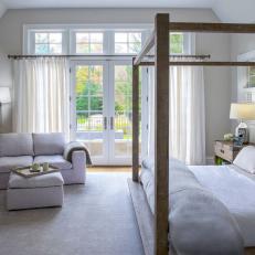Transitional Bedroom With Wood Canopy Bed