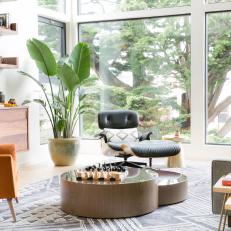 Neutral Midcentury Modern Living Room With Orange Armchair