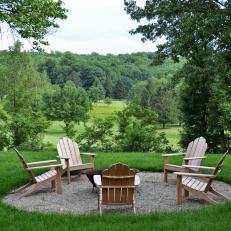 Fire Pit with Surrounding Adirondack Chairs