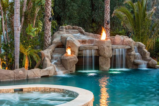 contemporary pool with rock waterfall