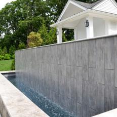 Modern Spillway Adds Ambiance to Backyard Space