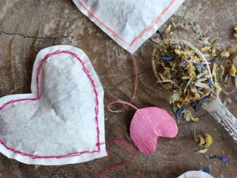 This DIY from HonestlyYUM is one gift that your friends won’t be expecting this Valentine’s Day. Inexpensive, inventive and useful, these coffee filter tea sachets are hand-cut and sewn, and filled with your choice of loose tea. 
