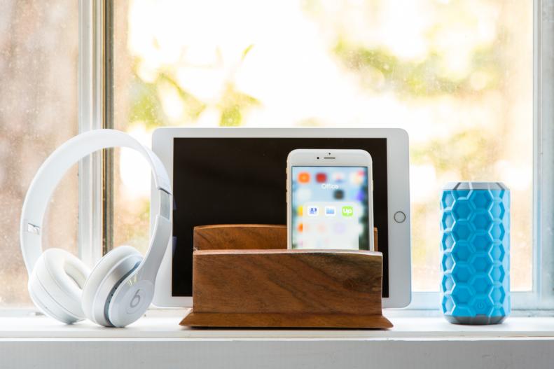 If your window is private and secure, a sill could be a terrific perch for a Bluetooth speaker and devices.  Repurpose an old letter organizer or napkin holder as a low-tech charging station. 