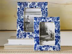 Two Picture Frames on a Table With Floral Patterns