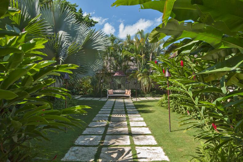 tropical garden with stone walkway