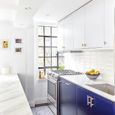 Blue and White Galley Kitchen With Fruit Bowl