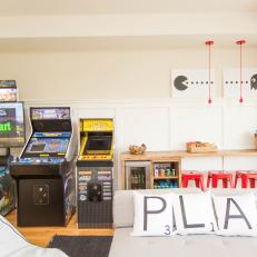 Contemporary Game Room With Red Barstools