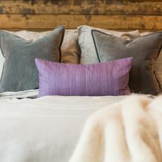 Purple and Gray Accents Add Color and Contrast to the Neutral, Rustic-Contemporary Bedroom 