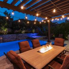 Outdoor Dining Area Shines With Fireplace, Bistro Lights