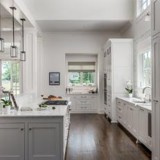 White Open Plan Kitchen With Wood Floor