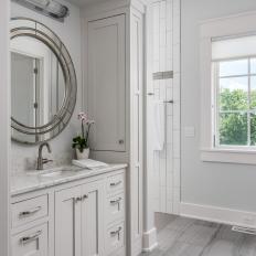 Gray Bathroom With Round Mirror