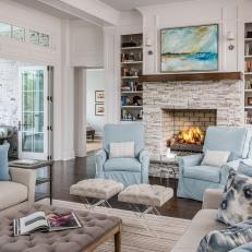 White and Blue Traditional Living Room With Stone Fireplace