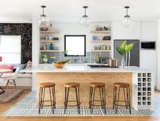 HGTV Magazine features the kitchen in a 1941 Los Angeles bungalow, where tile is used on the floor and on the walls.