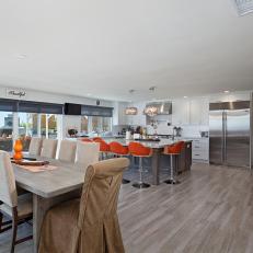 Open Plan Modern Kitchen With Orange Barstools