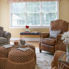 Family Room Sitting Area With Leather Armchairs And Upholstered Ottoman