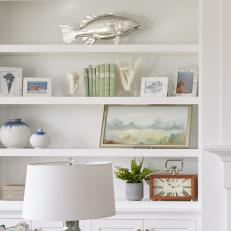 White Built-In Bookshelf With Fish