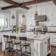 White Chef Kitchen With Exposed Beams