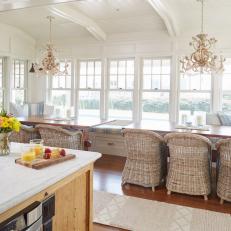 Coastal Dining Area With Two Chandeliers
