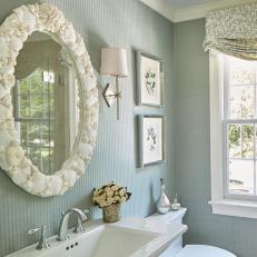 Blue Coastal Bathroom With Shell Mirror