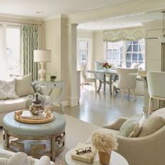 Neutral Cottage Living Room With Blue Ottoman