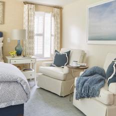 Neutral and Blue Transitional Bedroom With Glass Lamp