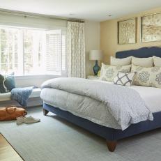 Neutral Coastal Bedroom With Blue Bed