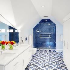 Blue and White Bathroom With Geometric Floor