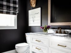 Black Bathroom Has White Vanity, Rustic Artwork and Custom Roman Shade