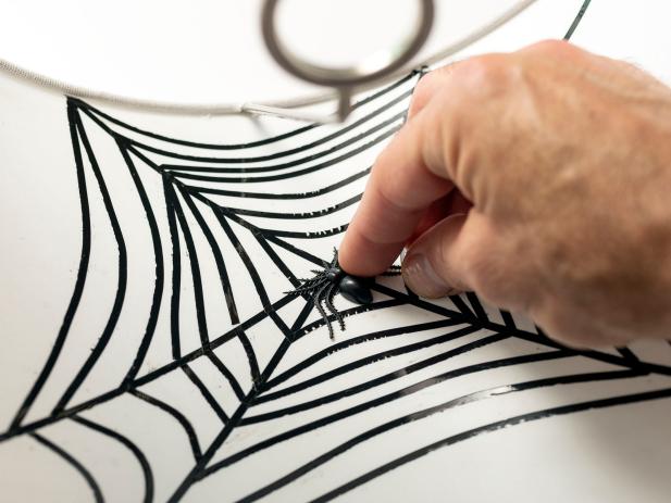 Learn how to make your own spiderweb lampshade halloween decoration.