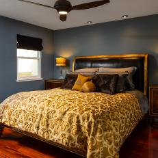 Gray Bedroom With Yellow Bed Linens