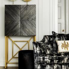 Black and Gold Sitting Area With Cabinet