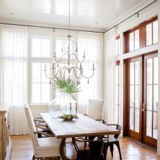White Eclectic Dining Room With Paneling