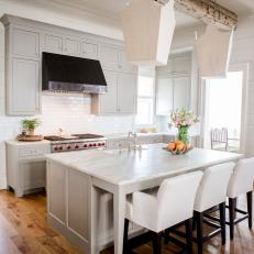 Gray and White Kitchen With Exposed Beam