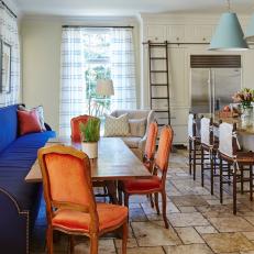 Eclectic Eat-In Kitchen With Orange Chairs