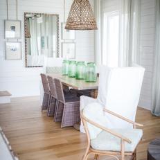 Neutral Coastal Dining Room With Green Vases