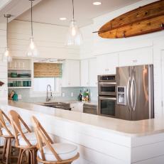 White Coastal Open Plan Kitchen With Surfboard