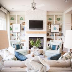 White Coastal Living Room With Blue Pillows