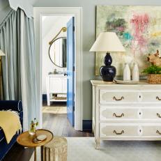 Blue Eclectic Sitting Area With White Dresser
