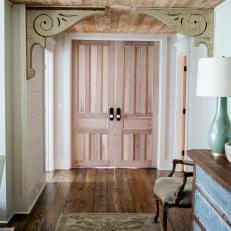 Country-Style Entryway With Reclaimed Wood Ceiling