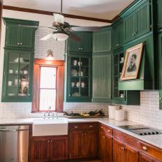 Neutral Craftsman Kitchen with Green Cabinets and Range Hood