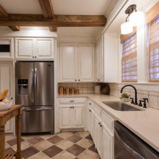 White French Country Kitchen with Brown Tile Floors 
