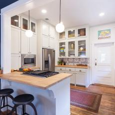 Contemporary White Kitchen with Neutral Butcher Block Countertops 