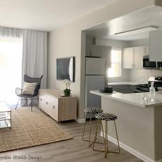 Neutral Kitchen and Living Room With Stools