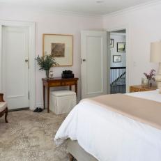 Neutral Transitional Master Bedroom With Antique Chair