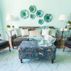 Blue Eclectic Sitting Room With Animal Ottoman