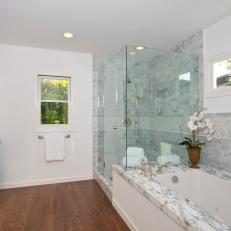 Neutral Bathroom With Marble Tub Surround