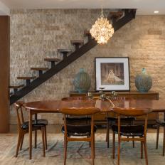 Midcentury Modern Dining Room With Stone Wall