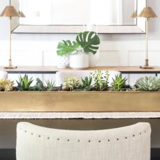 Formal Dining Room Boasts Brass Centerpiece With Succulents