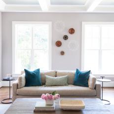 Neutral Sofa With Teal Pillows Enlivens Transitional Living Room